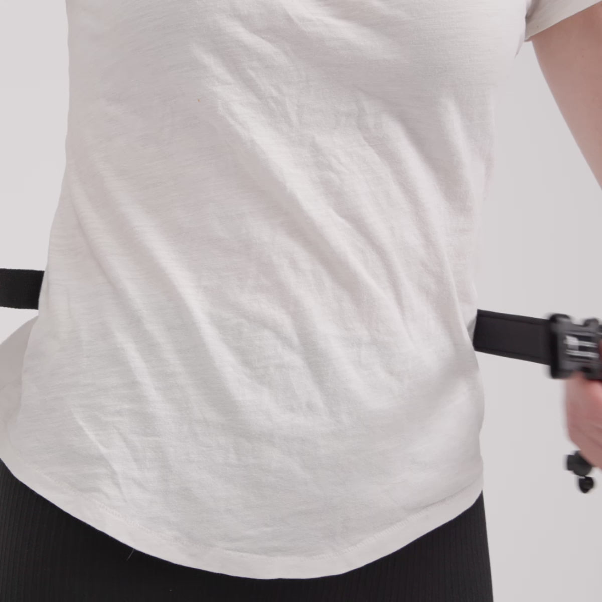 Woman walking dog using EzyDog Road Runner Leash in hands-free mode – showcases leash movement, comfort, and waist fit during active use.