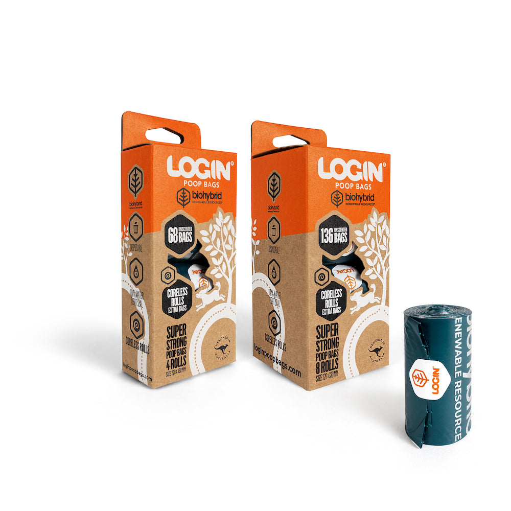 Two boxes and a roll of LOGIN biodegradable poop bags.